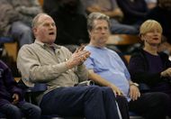 Stan Love (L) and Brian Wilson (C) watch Kevin Love play in 2006 (Image via Getty)